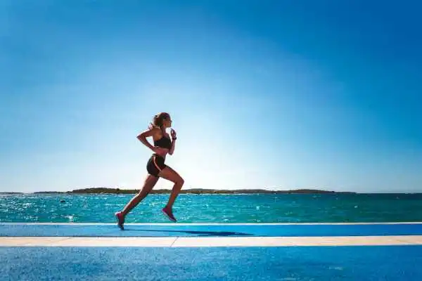 Woman running showing strong leg muscle Kirkby in Ashfield